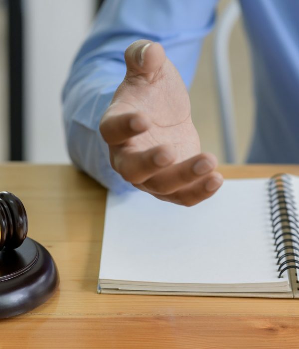 Close-up shot of Hammer on the table and lawyer introducing law, Concept of law.