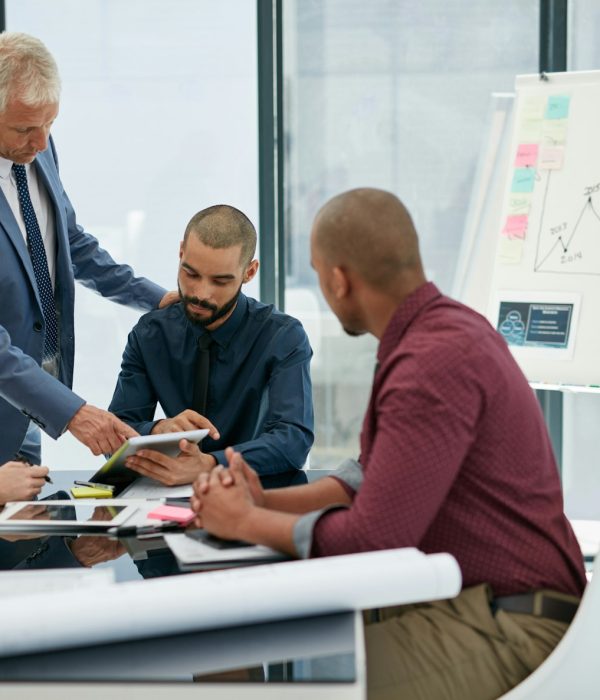 Giving his expert opinion. Shot of businesspeople working in an office.